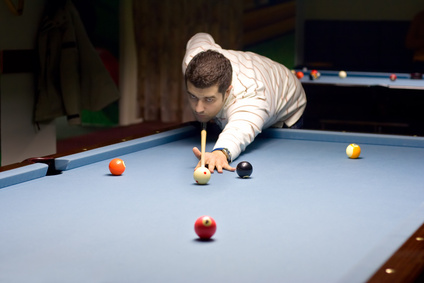 young person playing snooker